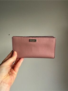 Kate Spade Laurel Way wallet in a soft pink peony color